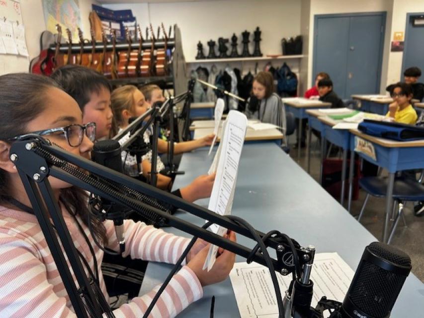 Students recording a podcast.
