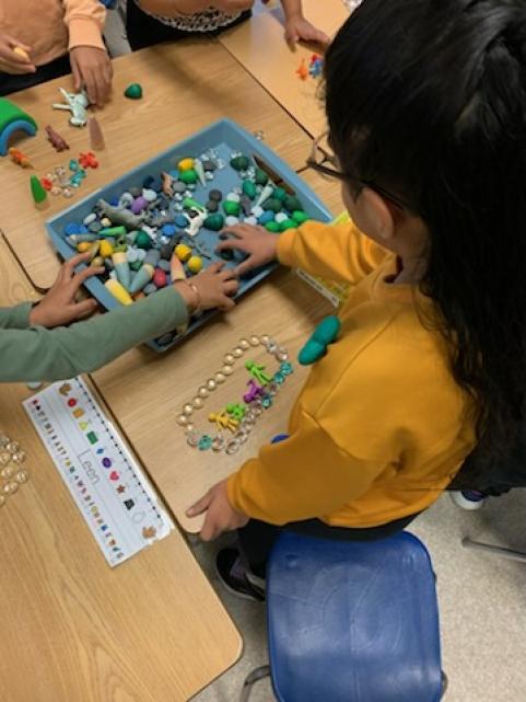 Students using loose parts.
